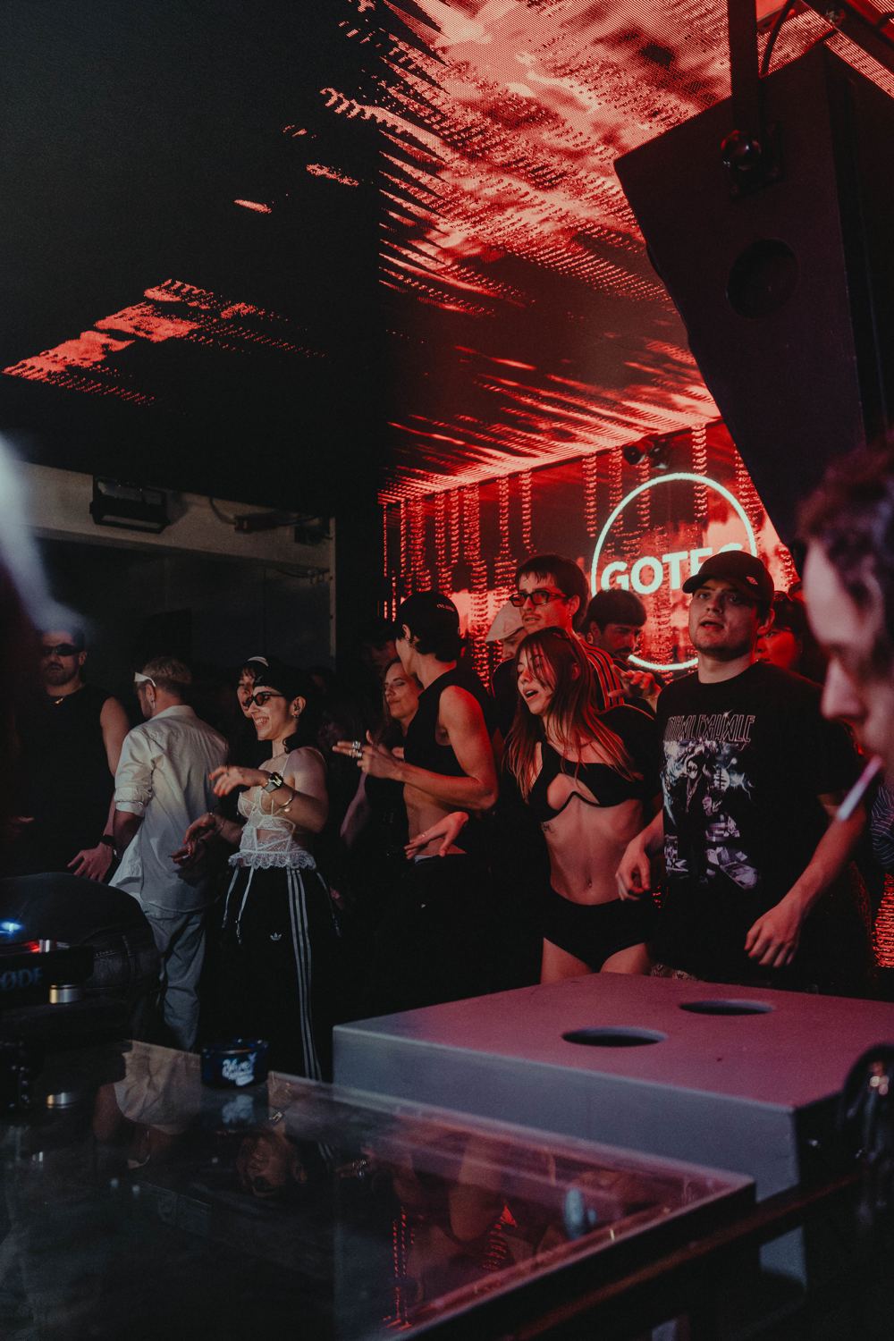 Dancers next to the DJ booth